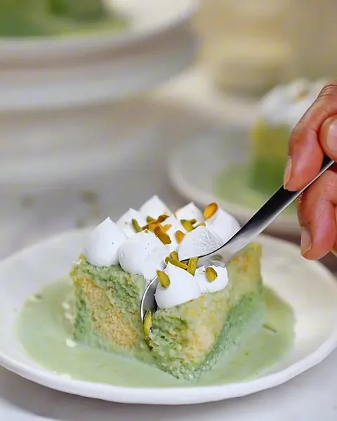 A pistachio cake slice styled for social media content